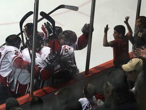 Leamington Flyers celebrate a first-period goal Sunday, March 30, 2014, during a game against the Chatham Maroons at the Leamington Kinsmen Recreation Complex. (DAN JANISSE/The Windsor Star)