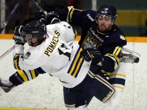 Windsor''s Spencer Pommells, left, collides with Lakehead's Cody Alcock at South Windsor Arena in Windsor on Thursday, March 6, 2014. (TYLER BROWNBRIDGE/The Windsor Star)