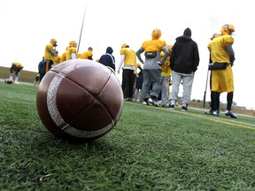 The Lancers football team take part in spring training at Alumni Field in Windsor on Monday, March 24, 2014.                      (TYLER BROWNBRIDGE/The Windsor Star)