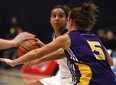 Windsor's Miah-Marie Langlois is guarded by Laurier's Nicole Morrison as she runs the offence as the Windsor Lancers host the Laurier Golden Hawks at the St. Denis Centre in the OUA women's basketball West final, Saturday, March 1, 2014.  Windsor defeated Laurier 86-58. (DAX MELMER/The Windsor Star)