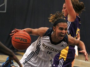 Windsor's Miah-Marie Langlois drives hard to the basket as the Windsor Lancers host the Laurier Golden Hawks at the St. Denis Centre in the OUA women's basketball West final, Saturday, March 1, 2014.  Windsor defeated Laurier 86-58. (DAX MELMER/The Windsor Star)