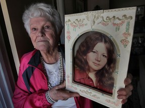 Diana Leroux is shown with a photo of her daughter Yvonne Leroux at her Windsor, Ont. home on Monday, March 31, 2014. Yvonne was murdered in 1972 at the age of 16. Her killer has never been found. (DAN JANISSE/The Windsor Star)