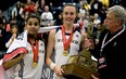 Windsor's Miah-Marie Langlois and Jessica Clemencon celebrate after winning the CIS Women's Basketball Champion at the St. Denis Centre in Windsor March 16, 2014. (JOEL BOYCE/The Windsor Star)