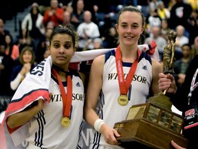 Windsor's Miah-Marie Langlois and Jessica Clemencon celebrate after winning the CIS Women's Basketball Champion at the St. Denis Centre in Windsor March 16, 2014. (JOEL BOYCE/The Windsor Star)