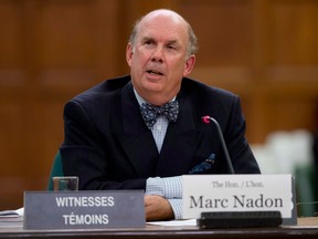 In this file photo, Justice Marc Nadon delivers his opening remarks as he appears before a parliamentary committee following his nomination to the Supreme Court of Canada Wednesday October 2, 2013 on Parliament Hill in Ottawa. THE CANADIAN PRESS/Adrian Wyld
