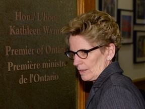 Ontario Premier Kathleen Wynne is shown outside her office at Queen's Park in Toronto on Thursday, March 27, 2014. Wynne has distanced herself from her predecessor, former premier Dalton McGuinty, following police allegations one of his staffers may have committed breach of trust. THE CANADIAN PRESS/Frank Gunn