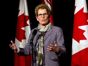 Ontario Premier Kathleen Wynne takes questions from the media in Port Hope, Ont. Friday, February 7, 2014. (Galit Rodan/The Canadian Press)