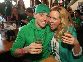 Jason Laughland and Barb Herbster celebrate St. Patrick's Day at  the Rock Bottom Bar and Grill in Olde Sandwich Towne, Sunday, March 16, 2014.  (DAX MELMER/The Windsor Star)