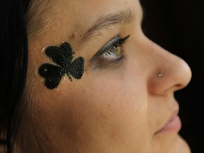 Paulina Serek sports a shamrock on her face at Rock Bottom during St. Patrick's Day celebrations along Sandwich Street in Windsor on Monday, March 17, 2014. Green beers flowed as partiers hit the bars early to ring in the holiday and carried on late into the night.                     (TYLER BROWNBRIDGE/The Windsor Star)