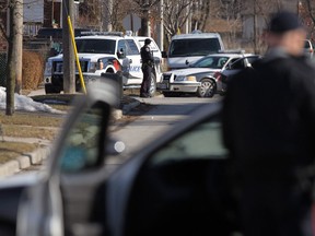 Windsor police surround an apartment on Pillette Road on March 26, 2014. (Tyler Brownbridge / The Windsor Star)