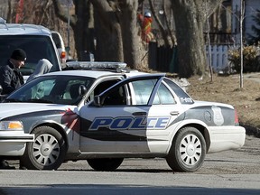 Windsor Police surround an apartment on Pillette Road near Wyandotte Street in Windsor on Wednesday, March 26, 2014. Police were looking for two suspects and recovered two pellet guns at the scene.                        (TYLER BROWNBRIDGE/The Windsor Star)