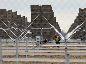 Construction crews continue to work on the large solar farm outside of Amherstburg in this 2011 file photo. (TYLER BROWNBRIDGE / The Windsor Star)
