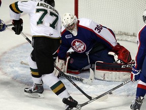 The Windsor Spitfires Dalen Kuchmey gives up a goal to the London Knights Josh Anderson at the WFCU Centre in Windsor on Tuesday, March 25, 2014.                       (TYLER BROWNBRIDGE/The Windsor Star)