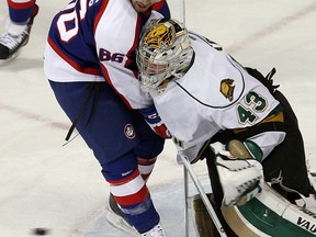 The Windsor Spitfires Josh Ho-Sang crashes into the London Knights Anthony Stolarz at the WFCU Centre in Windsor on Tuesday, March 25, 2014.                       (TYLER BROWNBRIDGE/The Windsor Star)