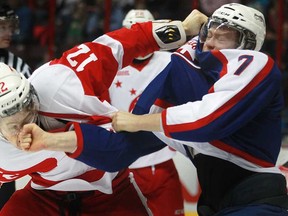 Windsor's Cameron Hughes, right, connects with a punch on Sault St Marie's Jorgen Karterud during OHL action at the WFCU Centre, Sunday, March 9, 2014.  Sault Ste Marie defeated Windsor 5-1.  (DAX MELMER/The Windsor Star)