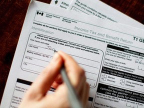 Canada Revenue Agency tax forms are shown in this 2010 file photo. (Chris Young / Canadian Press)