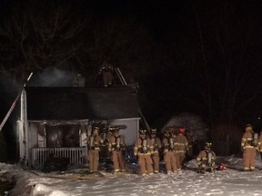 Tecumseh firefighters extinguish hot spots at a house fire at 1440 Shawnee Rd. on Monday, March 10, 2014. (Twitpic: Dylan Kristy/The Windsor Star)