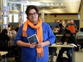 Mike Maher, a third year law student at the University of Windsor, campaigns in the CAW Student Centre on March 13, 2014. (Dylan Kristy / The Windsor Star)