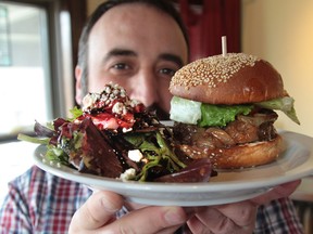 Rino Bortolin offers a new Wagyu beef burger at his Kitchen and Ale House. (JASON KYRK / The Windsor Star)