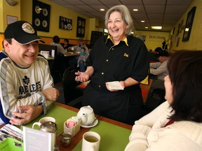 Deb Smith, owner of Deb’s Diner, shares a laugh with regulars Angelo and Kathy Alfini recently at Deb’s Diner. Smith is known to have a peculiar sense of humour with her customers. (DAX MELMER / The Windsor Star)
