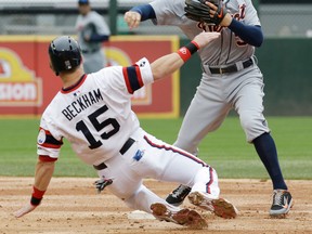 Detroit second baseman Ian Kinsler, right, throws to first base after forcing out Chicago's Gordon Beckham during the third inning Wednesday in Chicago. (AP Photo/Nam Y. Huh)