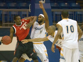 Windsor's Chris Commons, left, is guarded by Jeremy Williams of the Island Storm in Game 3 of the NBL of Canada final in Charlottetown. (The Guardian)