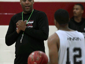 Express head coach Bill Jones, left, talks with Darren Duncan at practice. (NICK BRANCACCIO/The Windsor Star)