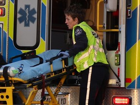 Essex-Windsor EMS paramedics at the scene of an accident on  E. C. Row Expressway in November 2013. (NICK BRANCACCIO/The Windsor Star)