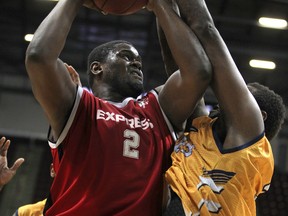 Windsor's Deandre Thomas, left, makes a move to the basket against the Island Storm's Casey Love at the WFCU Centre. (DAX MELMER/The Windsor Star)