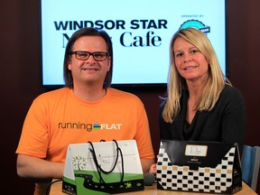 The Star's Kelly Steele with Running Flat race director Chris Uzynski, left, at News Cafe Wednesday April 16, 2014. (NICK BRANCACCIO/The Windsor Star)