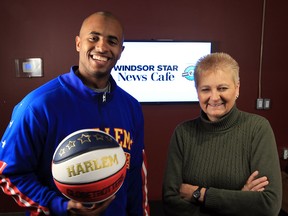 Harlem Globetrotter Dizzy Grant with The Star's Mary Caton at News Cafe Tuesday April 15, 2014. (NICK BRANCACCIO/The Windsor Star)
