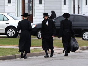 Members of the Lev Tahor community in Chatham, Ontario are seen on April 14, 2014. The ultra-orthodox religious group has won an appeal in the child protection case before the courts. (JASON KRYK/ The Windsor Star)