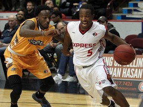 Windsor's Stefan Bonneau, right, is guarded by Shawn Vanzant of The Island Storm at the WFCU Centre. (NICK BRANCACCIO/The Windsor Star)