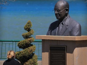 Jill Mailloux looks up at a bust of Rt. Hon. Herb Gray at Dieppe Park, Tuesday April 22, 2014.  Mr. Gray served Windsor West citizens from 1962 until 2002 and was elected member of parliament 13 consecutive times. Mr. Gray also served with International Joint Commission. Gray, 82, died yesterday in Ottawa.  (NICK BRANCACCIO/The Windsor Star)