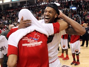 Windsor's Kevin Loiselle, left, and George Goode celebrate after beating the Island Storm in GAme 7 of the NBL of Canada final at the WFCU Centre. (TYLER BROWNBRIDGE/The Windsor Star)