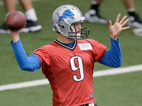 Detroit quarterback Matthew Stafford throws a pass Tuesday at the training facility in Allen Park. (AP Photo/Carlos Osorio)