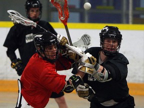 Windsor's Trevor Learn, left, and Kellen LeClair practise at Forest Glade Arena. (TYLER BROWNBRIDGE/The Windsor Star)