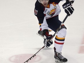 Belle River's Aaron Ekblad passes the puck against the Spitfires at the WFCU Centre. (DAN JANISSE/The Windsor Star)