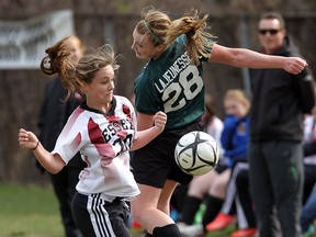 Essex's Elizabeth Stiers, left, and Lajeunesse's Simard Morgan battle for the ball during high school soccer action at Lajeunesse. (TYLER BROWNBRIDGE/The Windsor Star)