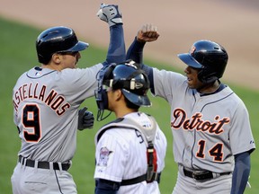 Detroit's Austin Jackson, right, congratulates Nick Castellanos after a two-run homer as Kurt Suzuki of the Minnesota Twins looks on during the second inning at Target Field in Minneapolis. (Photo by Hannah Foslien/Getty Images)