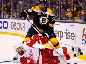 Boston's Zdeno Chara, top, stands over Detroit's Henrik Zetterberg in the second period in Game 5 at TD Garden Saturday. (Photo by Jared Wickerham)  (Photo by Jared Wickerham/Getty Images)