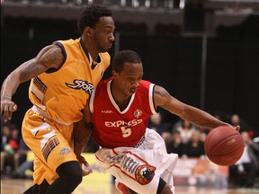 Windsor's Stefan Bonneau, right, drives around Shawn Vanzant of the Island Storm during Game 7  of the NBL championship final at the WFCU Centre. (TYLER BROWNBRIDGE/The Windsor Star)