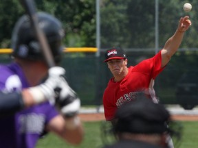 Windsor's Brett Siddall, right, pitches to Tecumseh's Derrick Fortier at Lacasse Park. (DAX MELMER/The Windsor Star)
