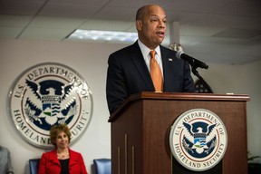 U.S. Secretary of Homeland Security Jeh Johnson administers the Oath of Allegiance to new United States citizens during a naturalization ceremony on April 2, 2014 in New York City. (Andrew Burton/Getty Images)