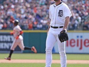 Justin Verlander #35 of the Detroit Tigers reacts after giving up a sacrifice fly to Adam Jones #10 of the Baltimore Orioles scoring Nick Markakis #21 during the eight inning of the game against the Detroit Tigers at Comerica Park on April 6, 2014 in Detroit, Michigan. The Orioles defeated the Tigers 3-1.  (Photo by Leon Halip/Getty Images)