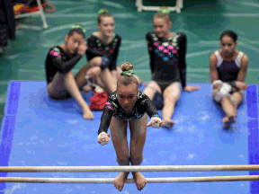 Competitors warm up at the Ontario Gymnastics Championships at the new St. Clair College SportsPlex in Windsor Thursday. (TYLER BROWNBRIDGE/The Windsor Star)