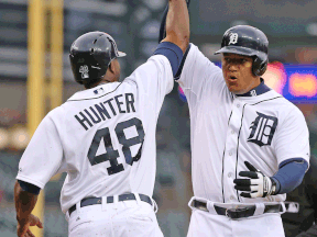 Detroit's Miguel Cabrera, right, celebrates after hitting a two-run homer for his 2,000 career hit during the eighth inning scoring Torii Hunter against the Baltimore Orioles at Comerica Park. (Photo by Leon Halip/Getty Images)