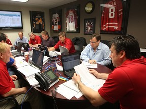 Windsor Spitfires general manager Warren Rychel, right, and members of the organization's staff participate in the 2010 OHL Draft at the WFCU Centre. (DAN JANISSE/The Windsor Star)