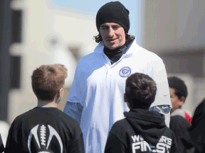 LaSalle's Luke Willson of the Seattle Seahawks talks with young football players at Windsor's Finest Football Academy at Alumni Field Saturday. (DAX MELMER/The Windsor Star)