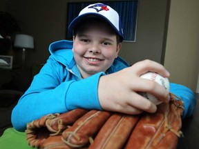 Hunter Bondy, 11, pictured at his home Friday, April 18, 2014, is the first National Honorary Chair for this year's Walk Now for Autism.  Bondy's first major public appearance will be throwing out the first pitch at this Thursday's Toronto Blue Jays game.  (DAX MELMER/The Windsor Star)